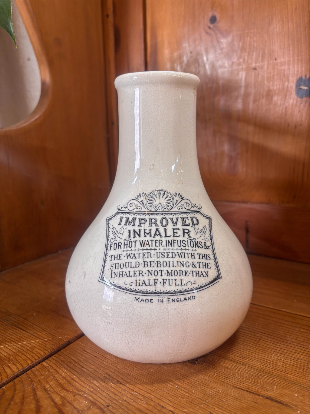 White ceramic inhaler on a wooden surface