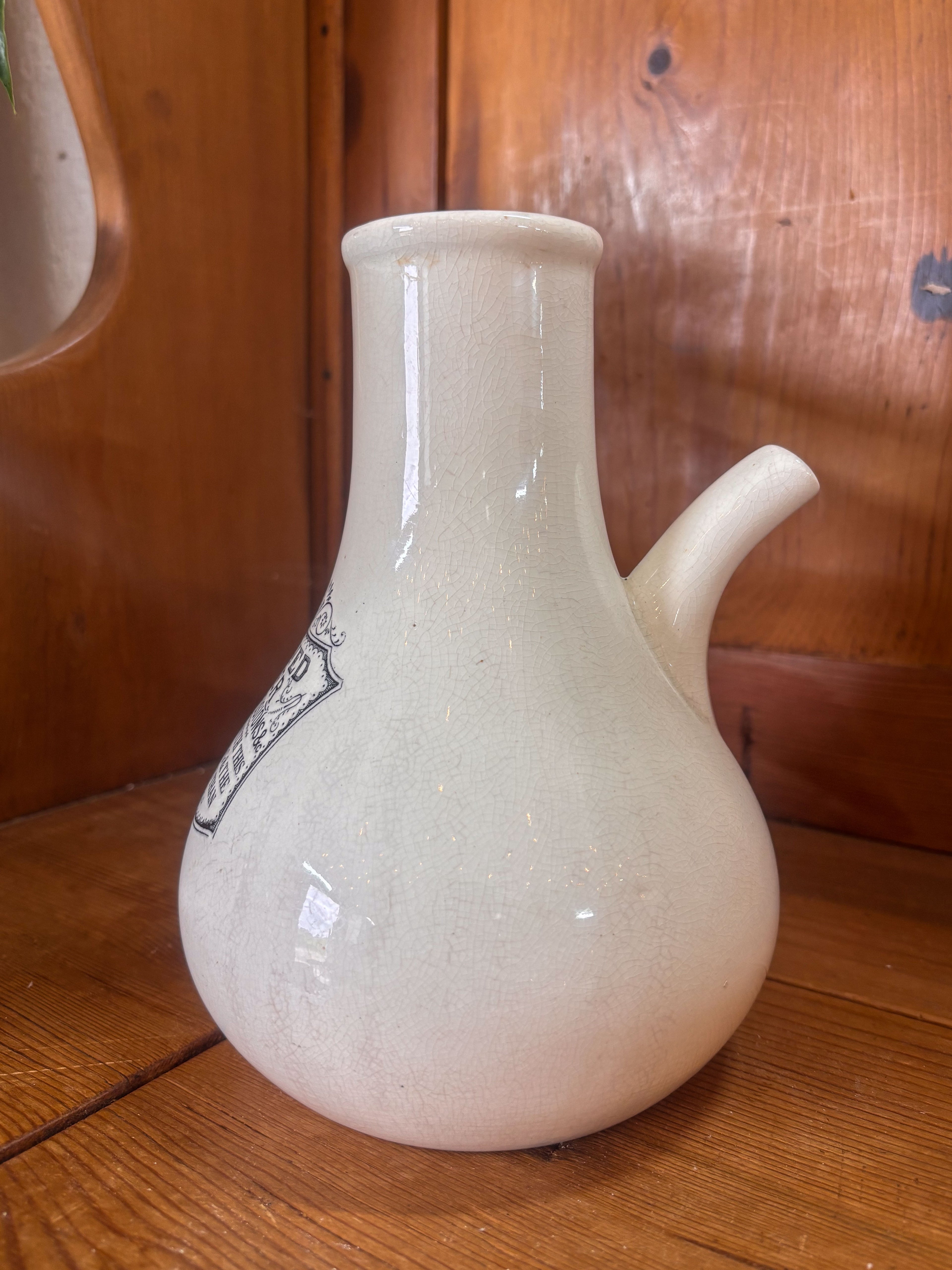 White ceramic inhaler on a wooden surface with a wooden background