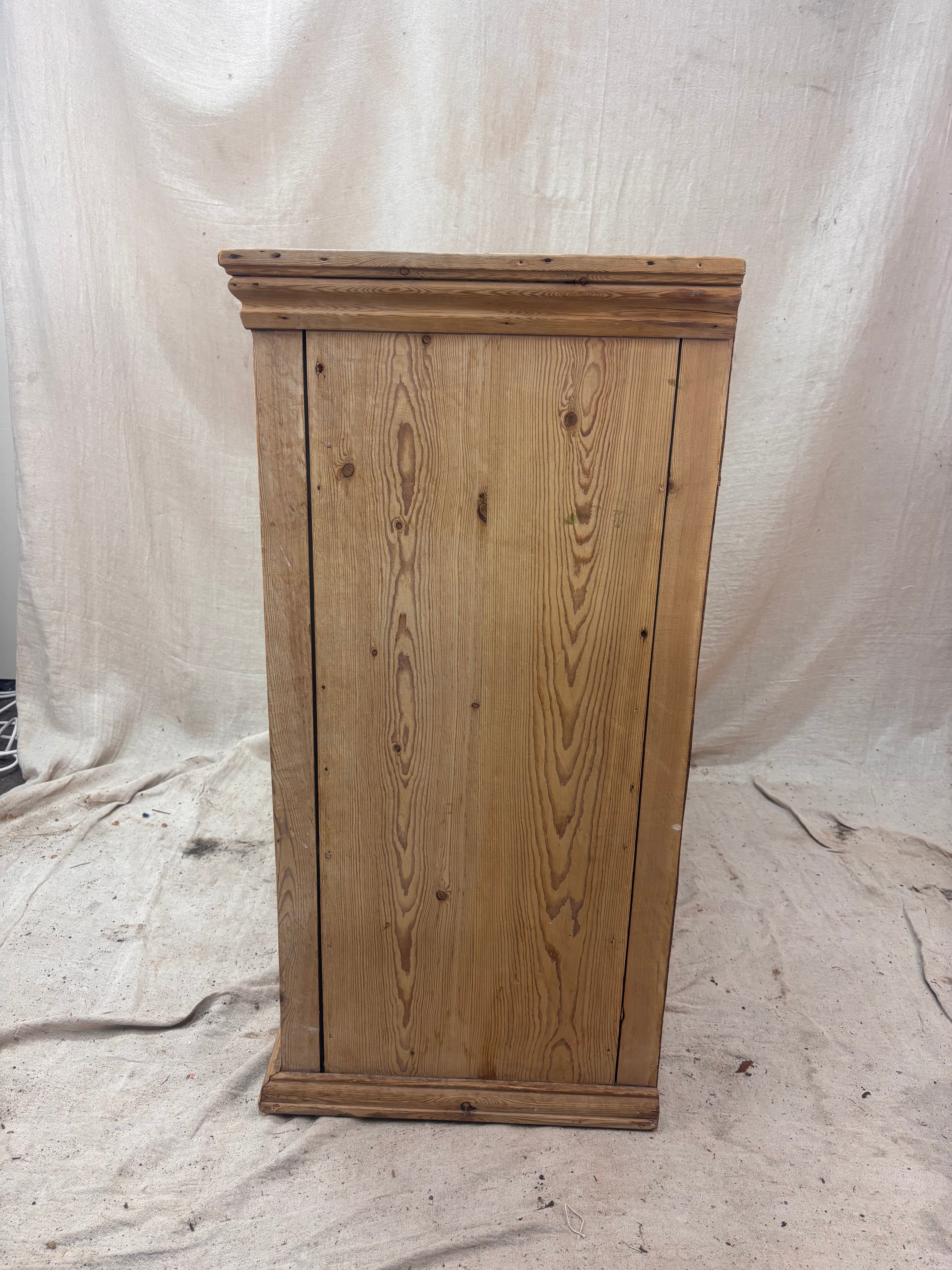 Wooden cabinet on a white fabric background