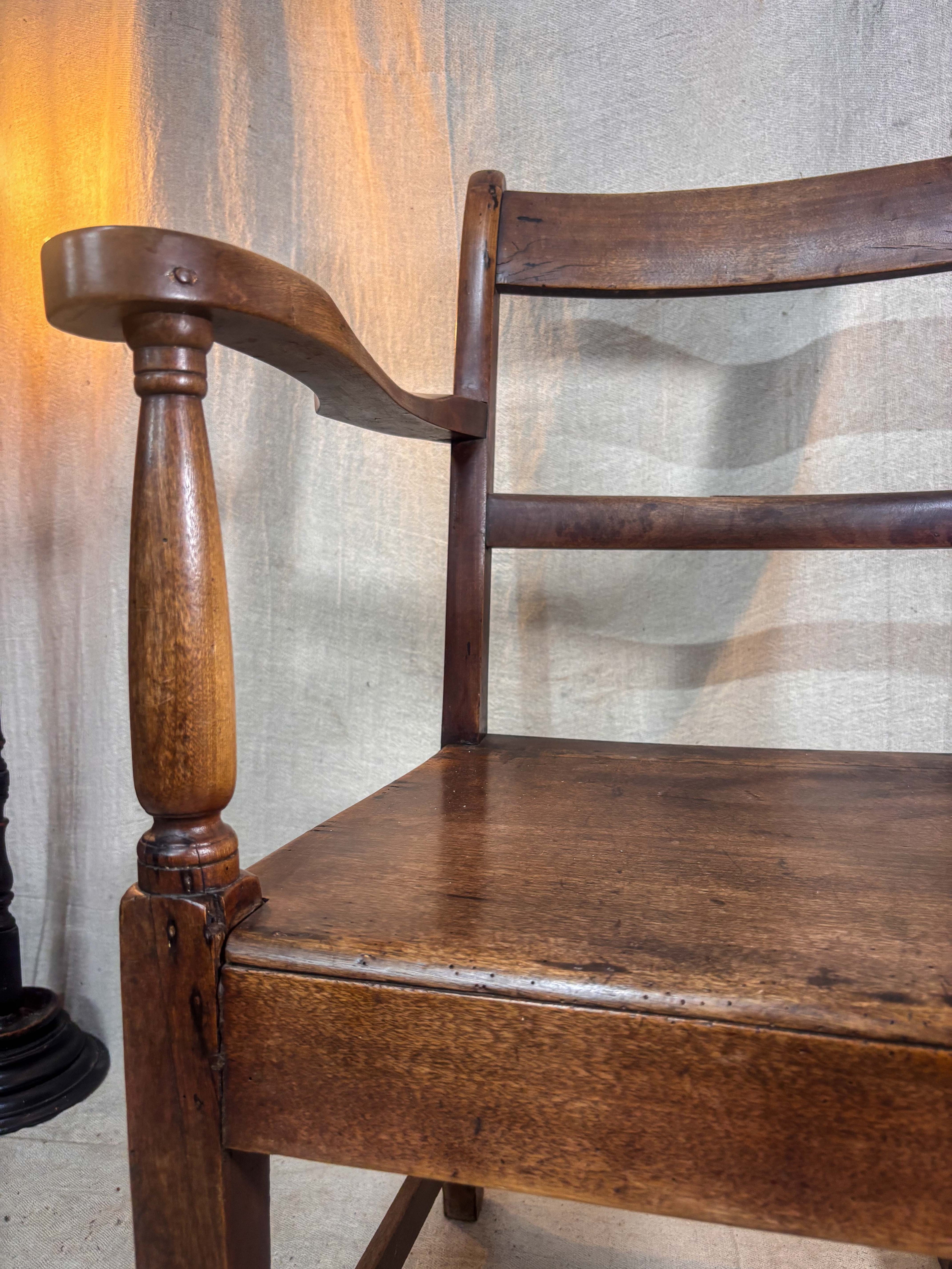Wooden chair with a textured wall in the background