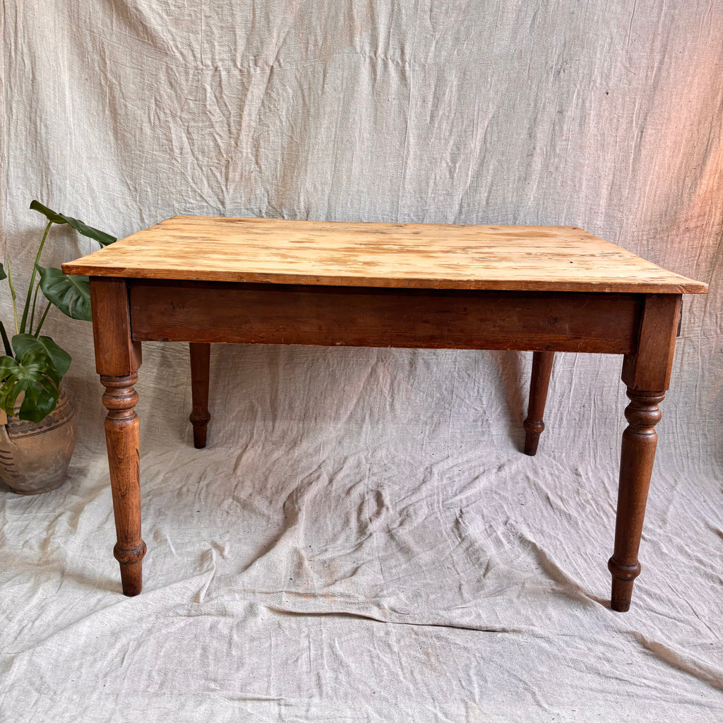 Wooden table on a textured white fabric background