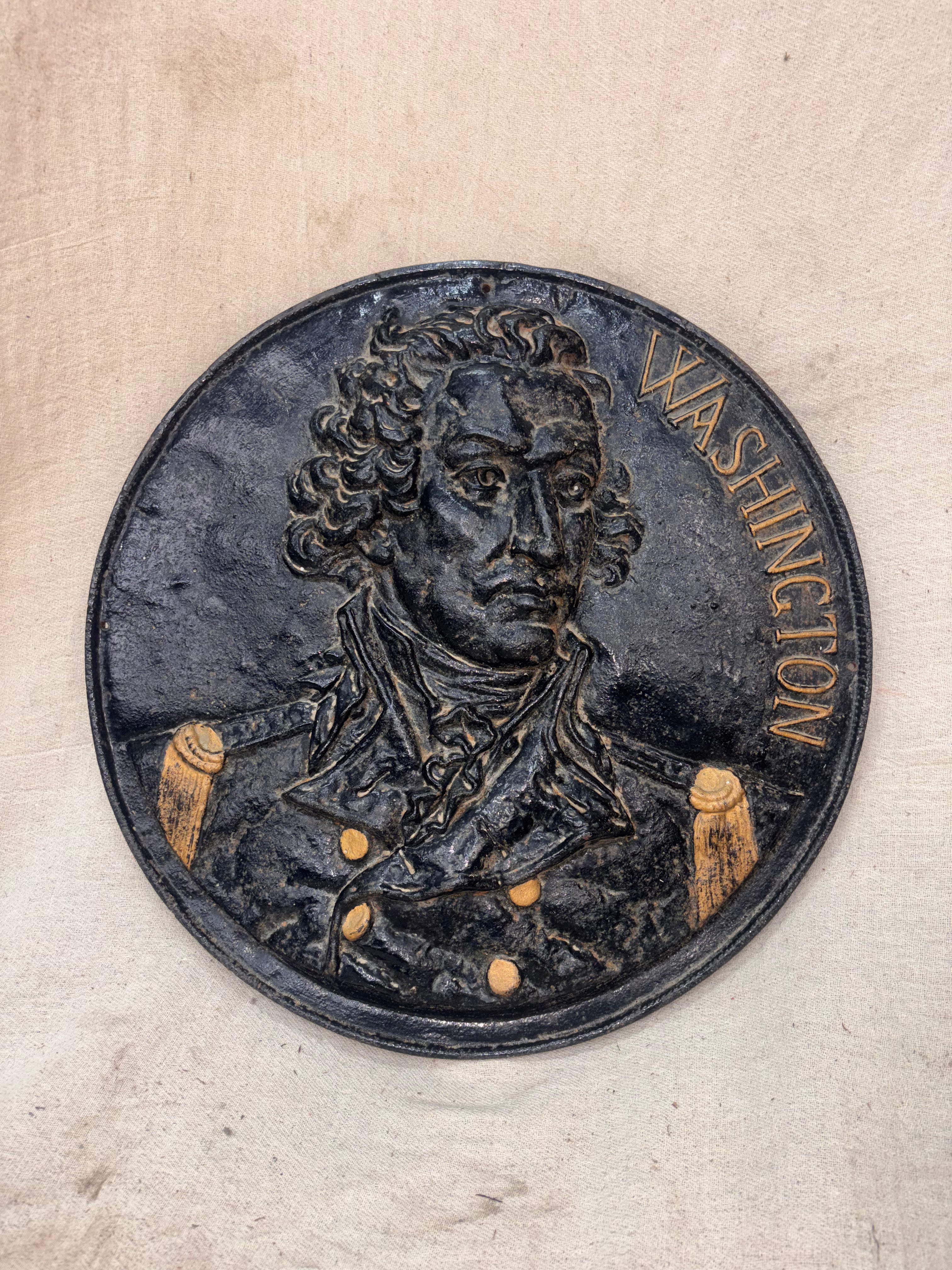 Medallion with a portrait of a historical figure and the name 'Washington' on a beige background