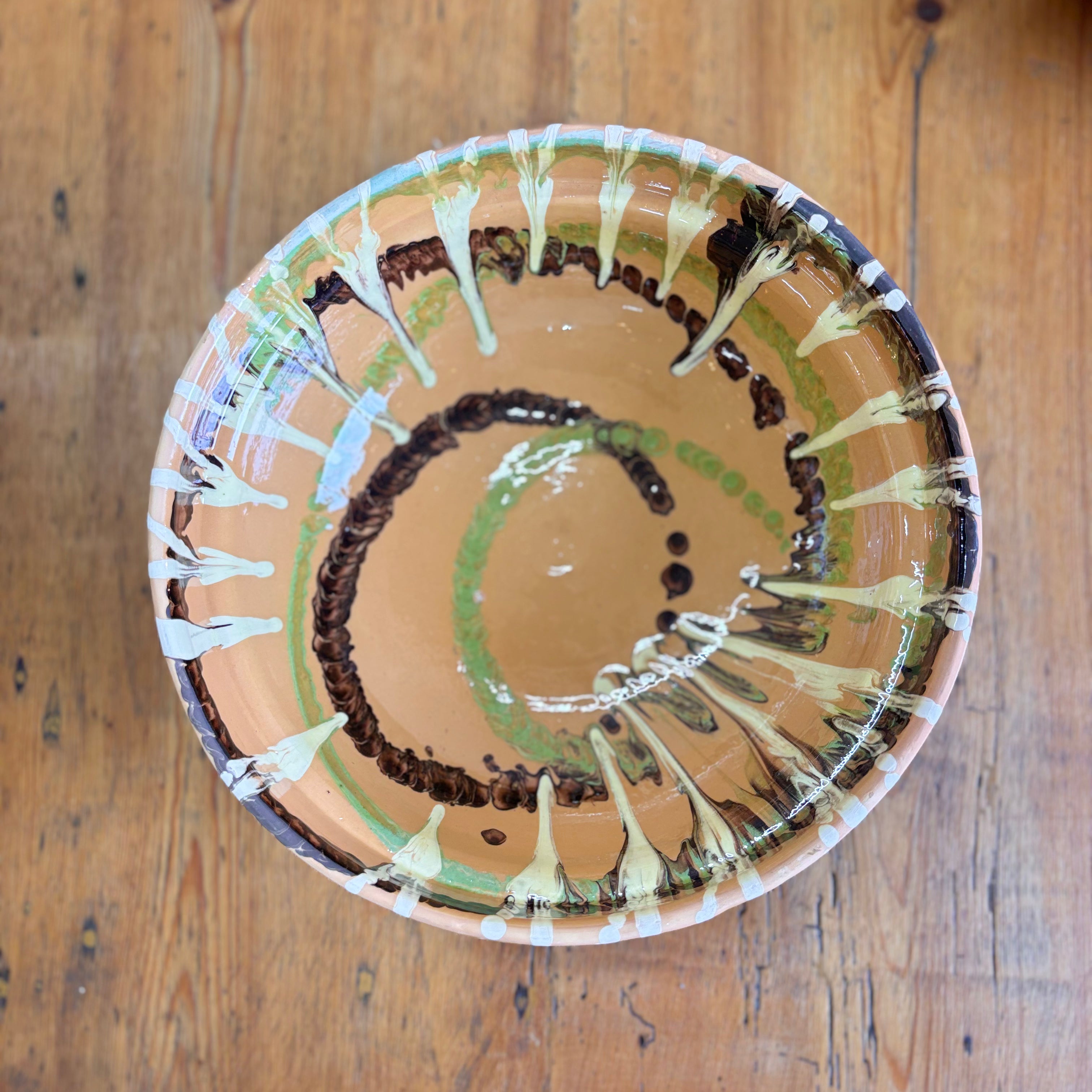 Ceramic plate with a decorative design on a wooden surface