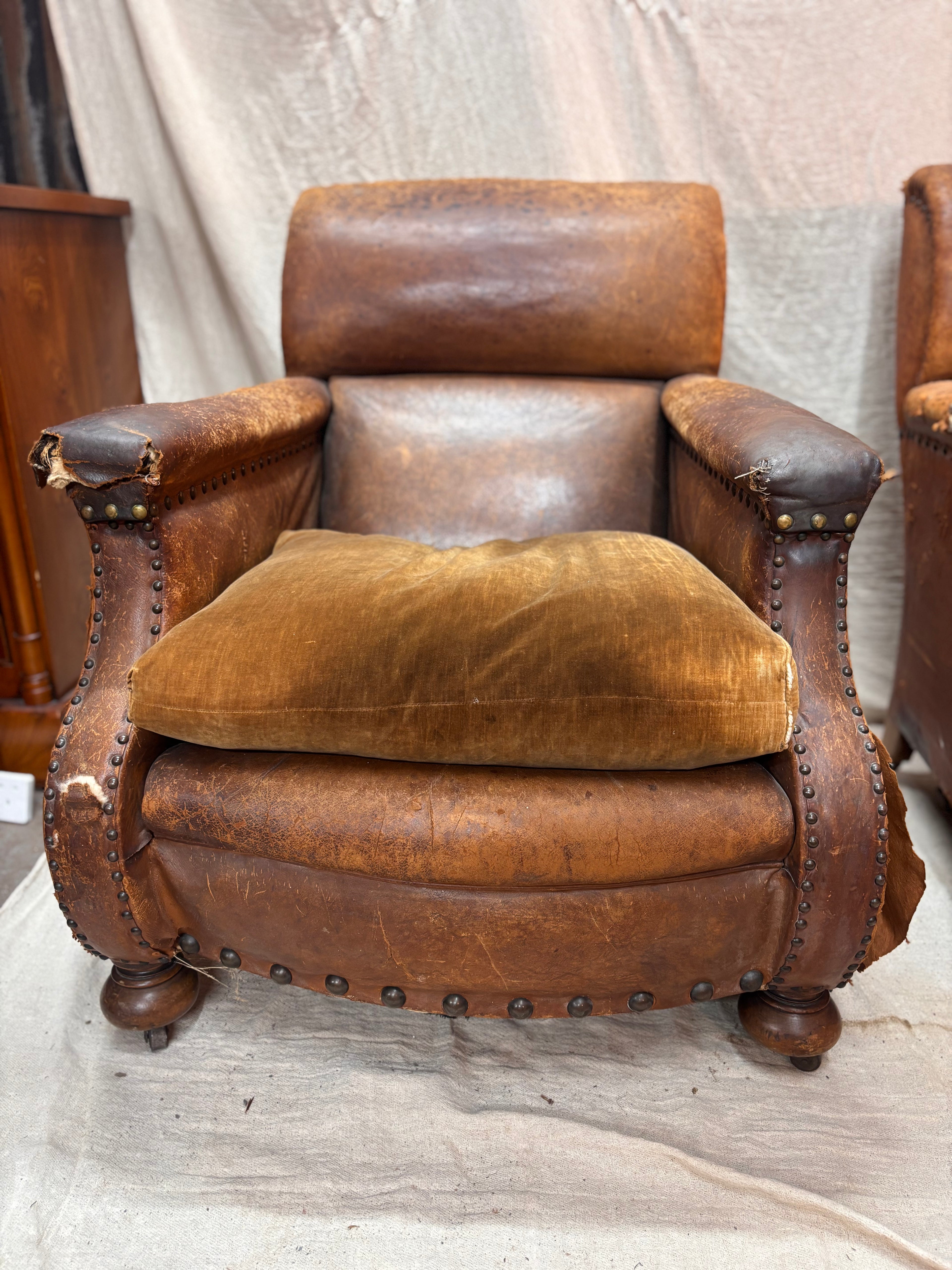 A Pair of Brown Leather Club Chairs.