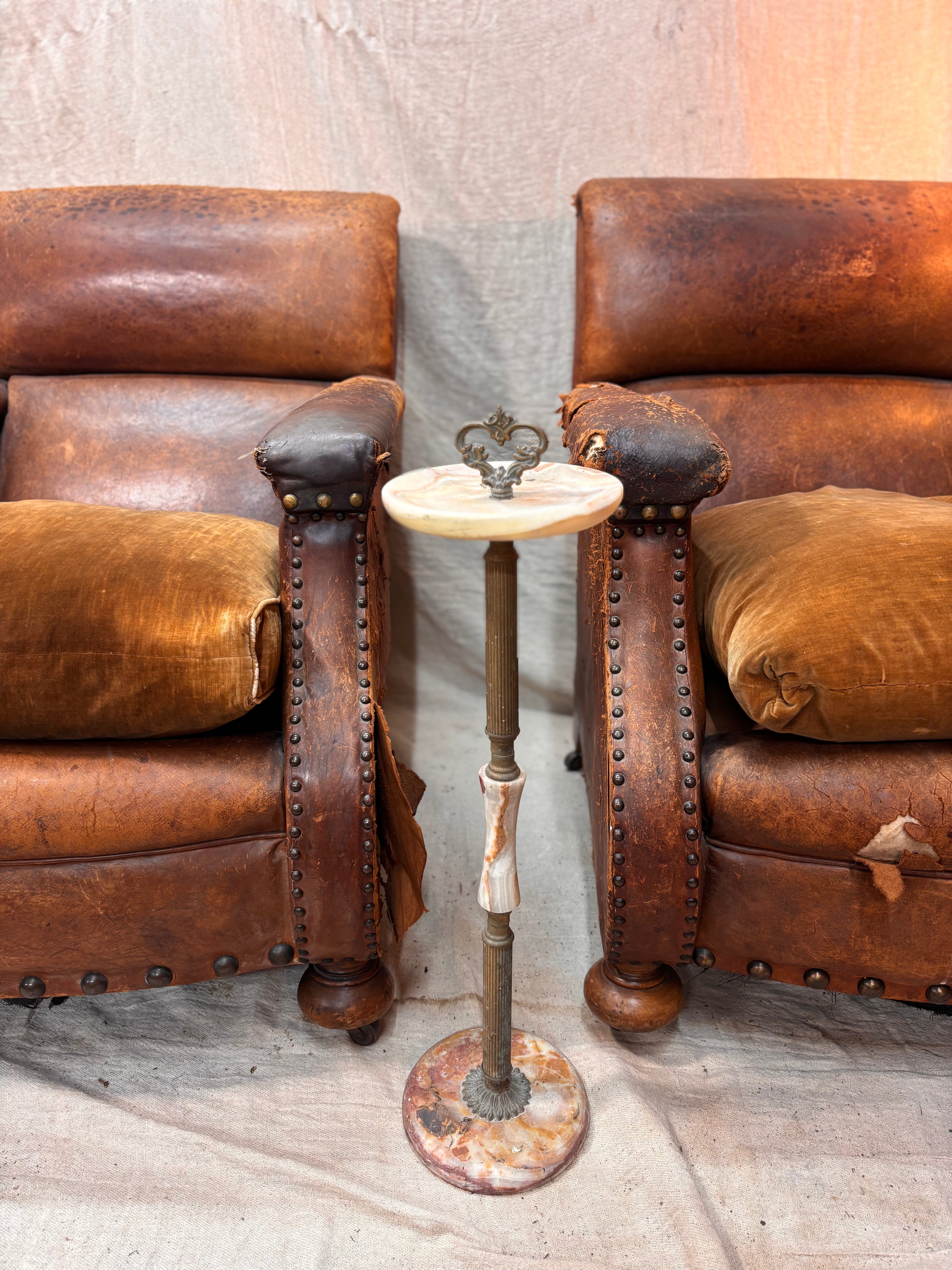 A Pair of Brown Leather Club Chairs.