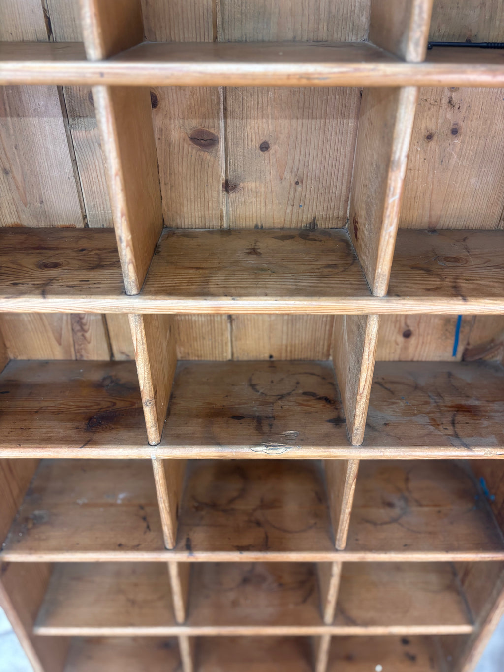 Wooden shelving unit with multiple compartments