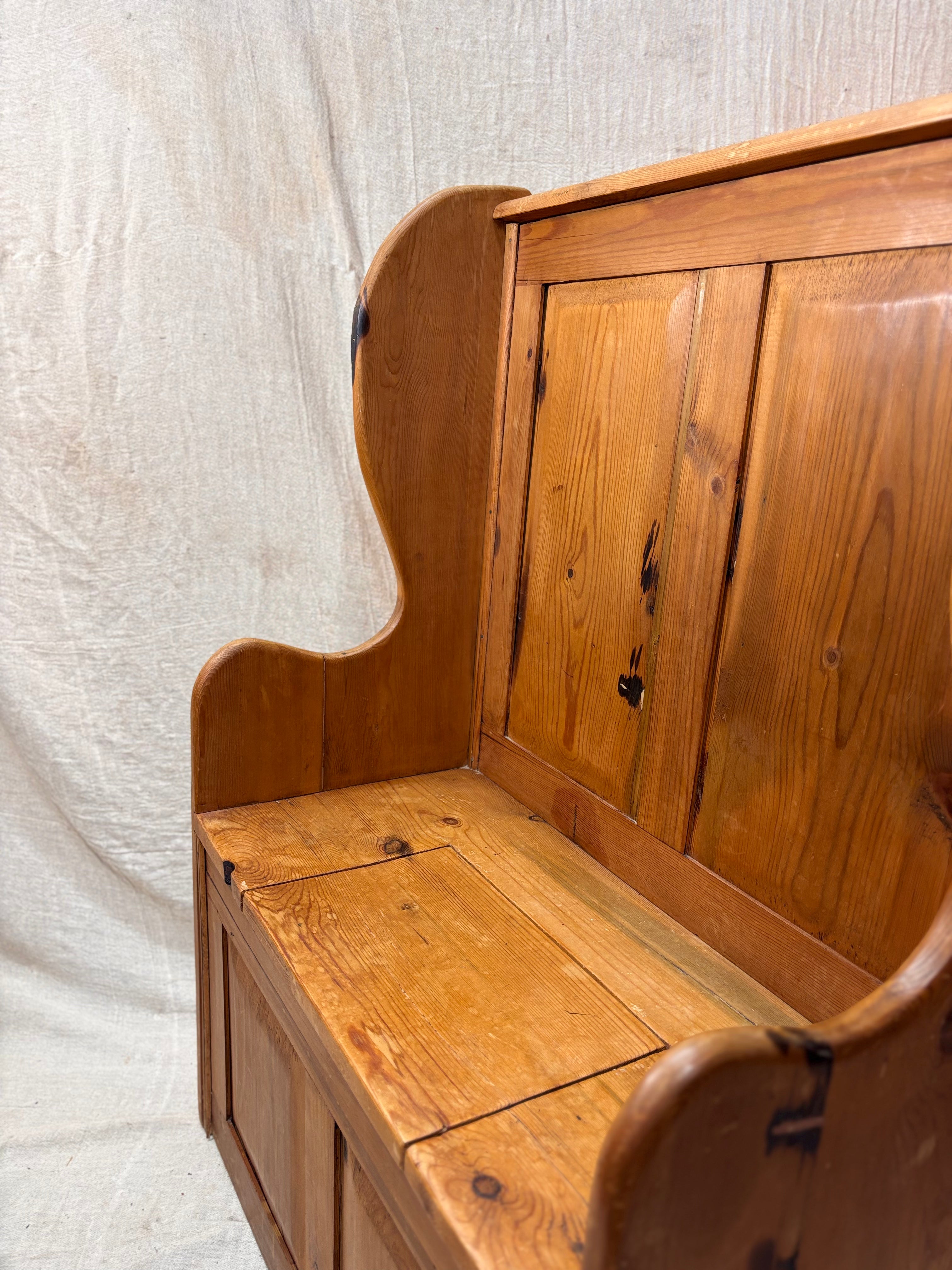 Wooden bench with backrest on a textured white background