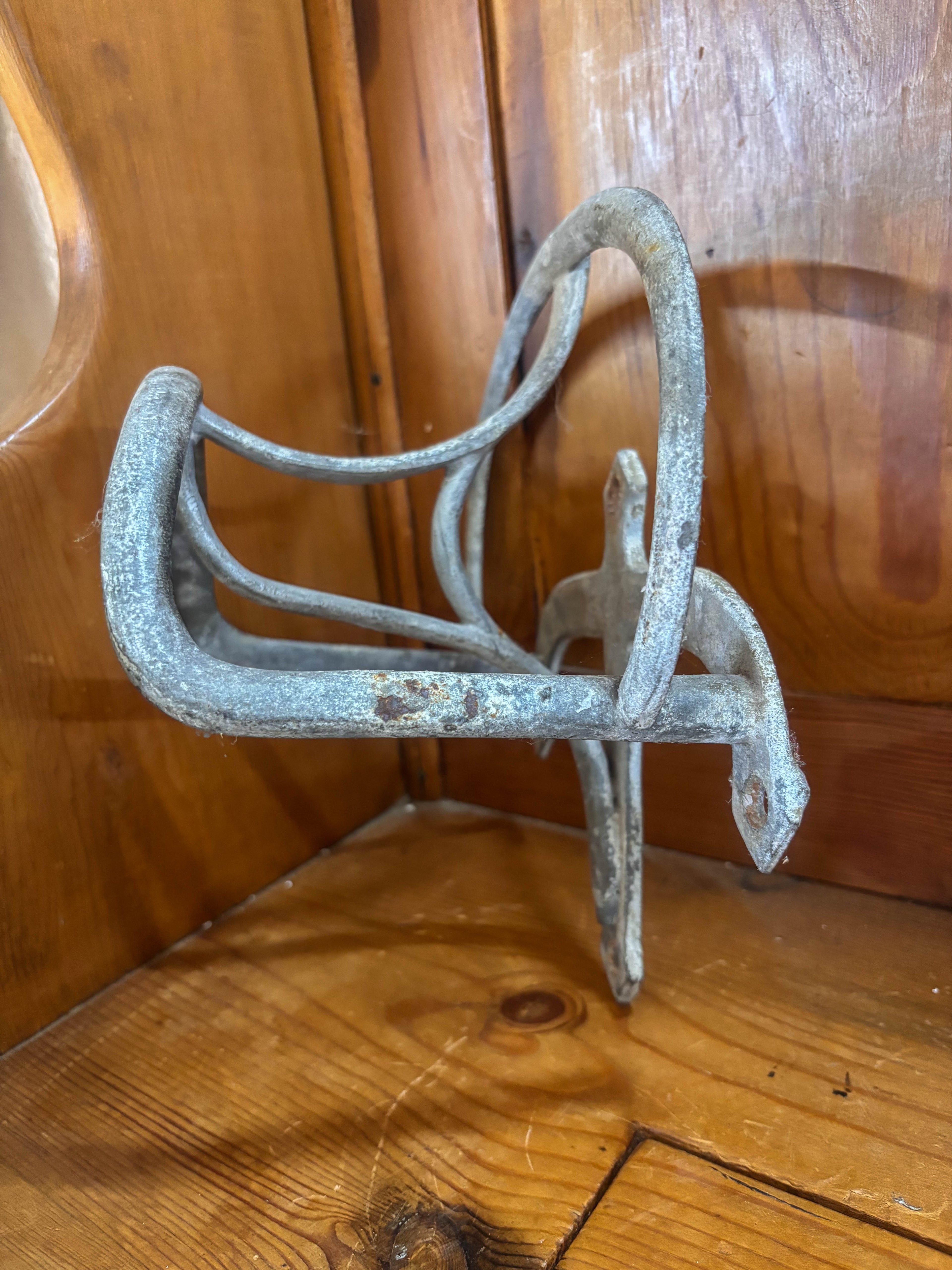 Metal bracket on a wooden surface