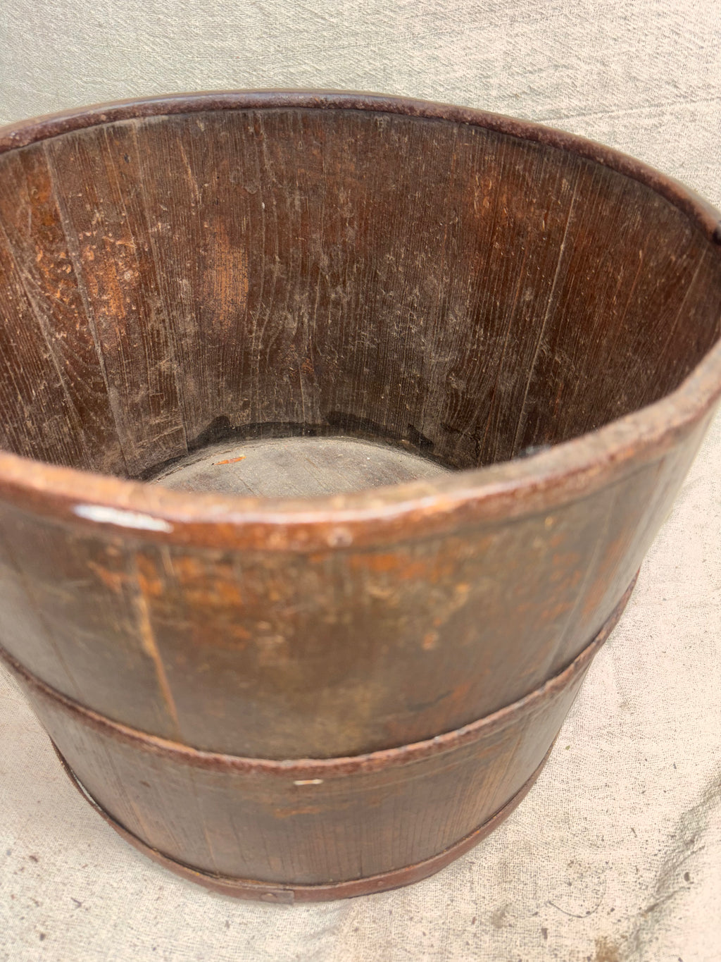Wooden bucket on a concrete floor
