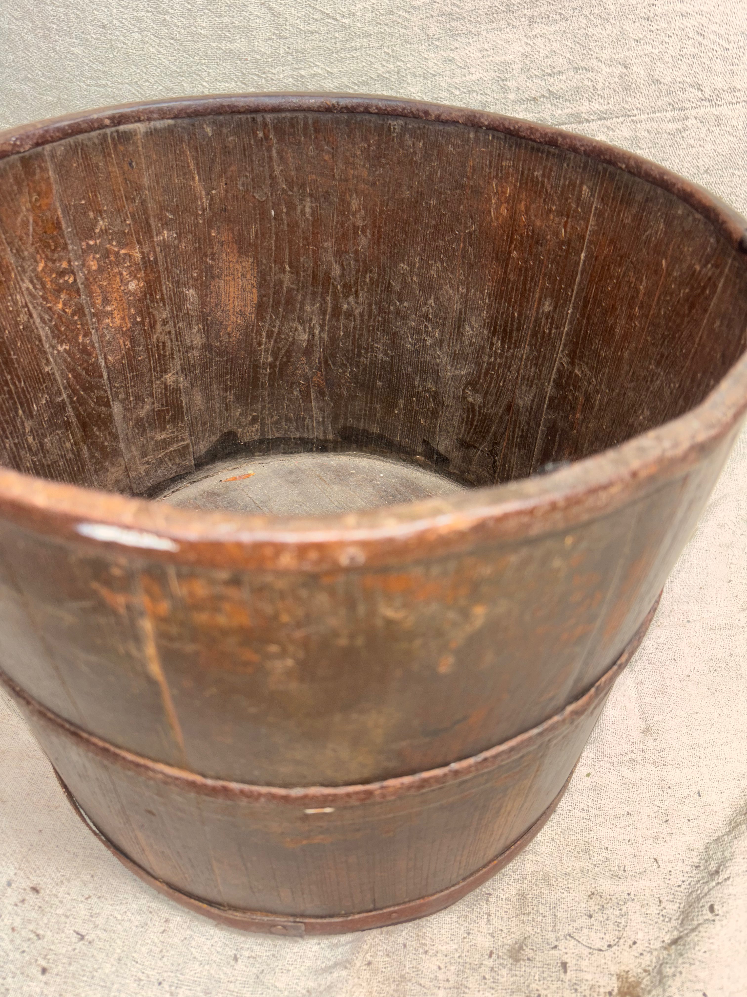 Wooden bucket on a concrete floor