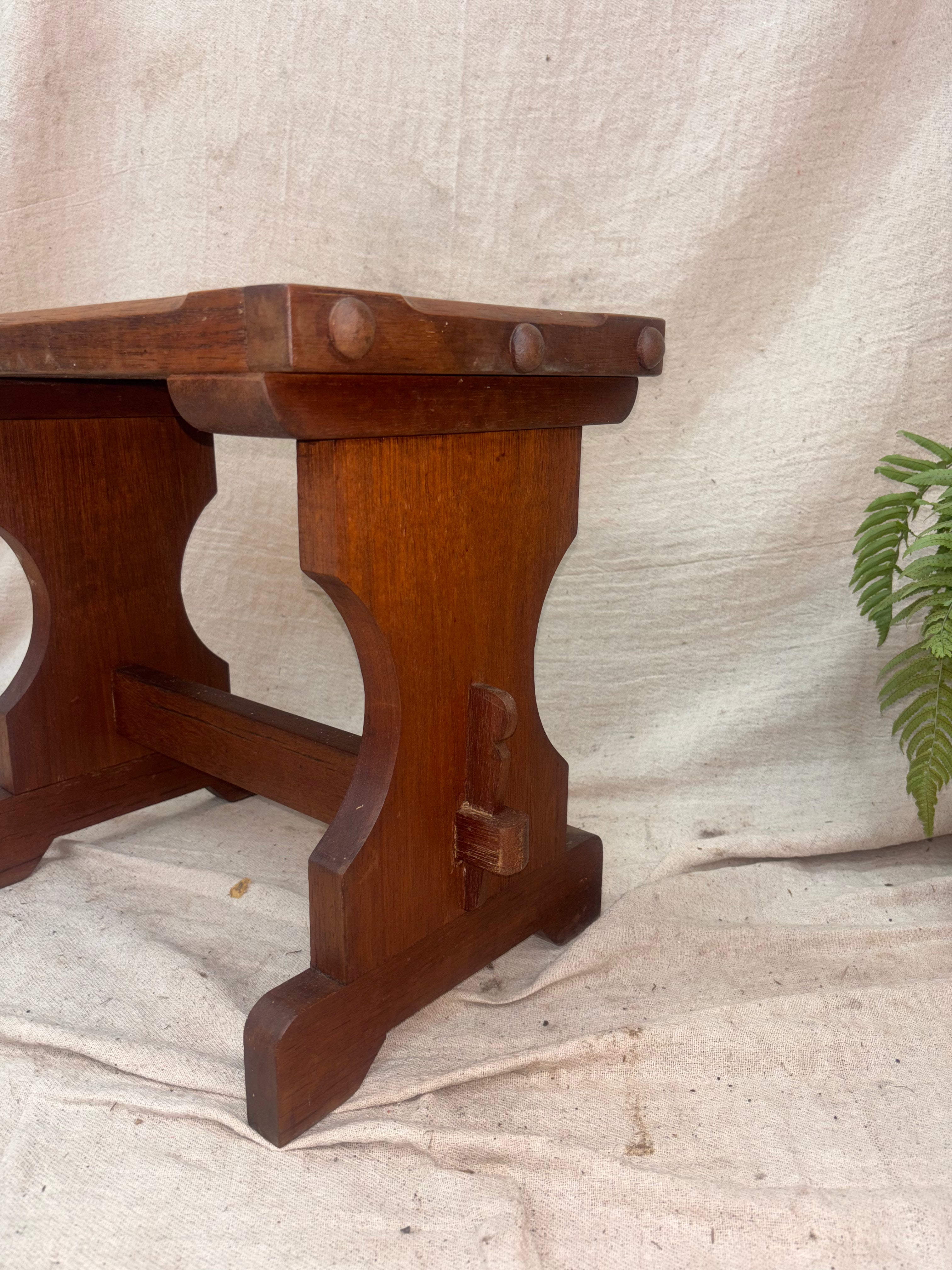 Wooden stool on a textured fabric background