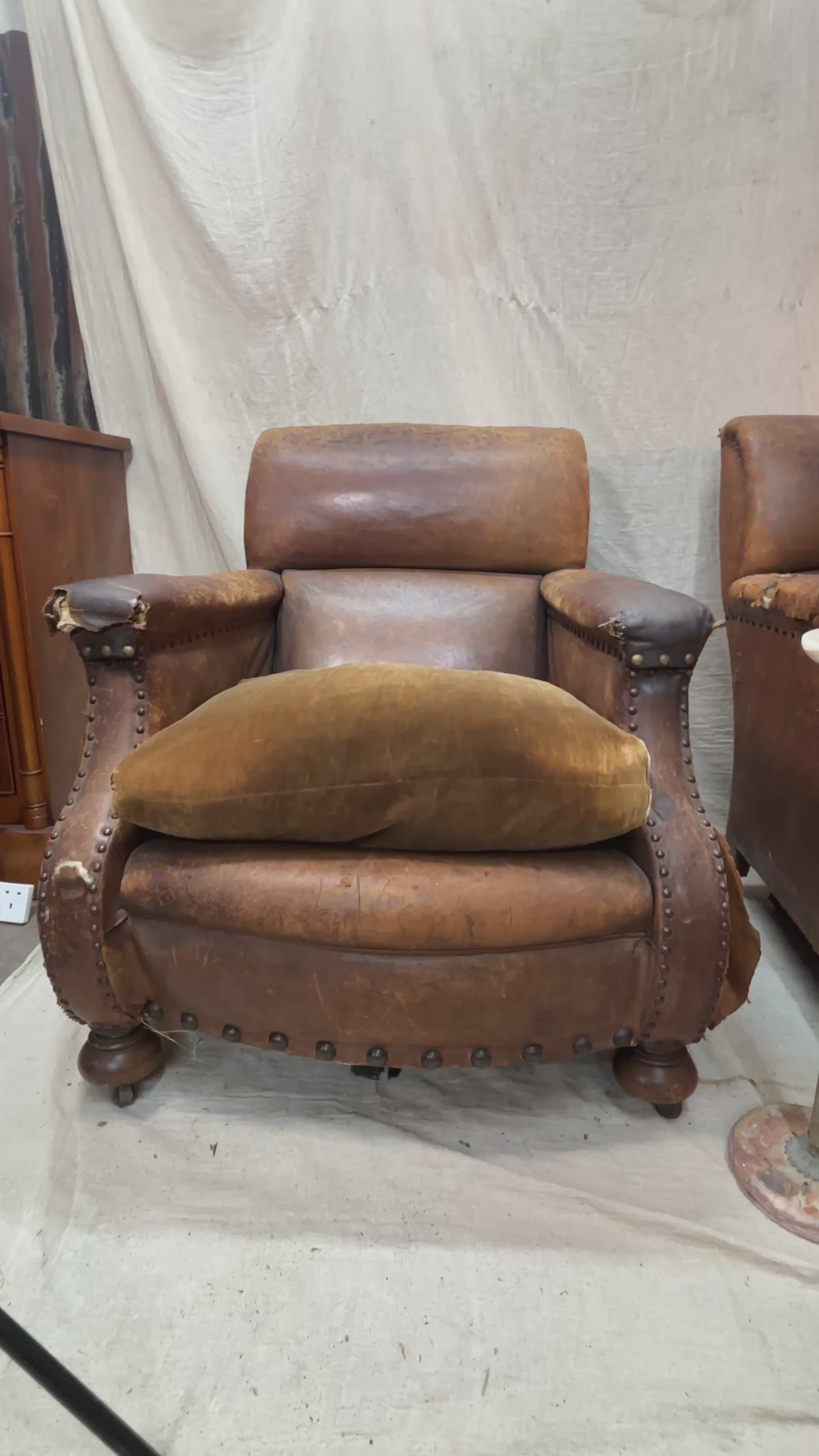 A Pair of Brown Leather Club Chairs.